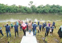 A Morning by the River Planting Trees